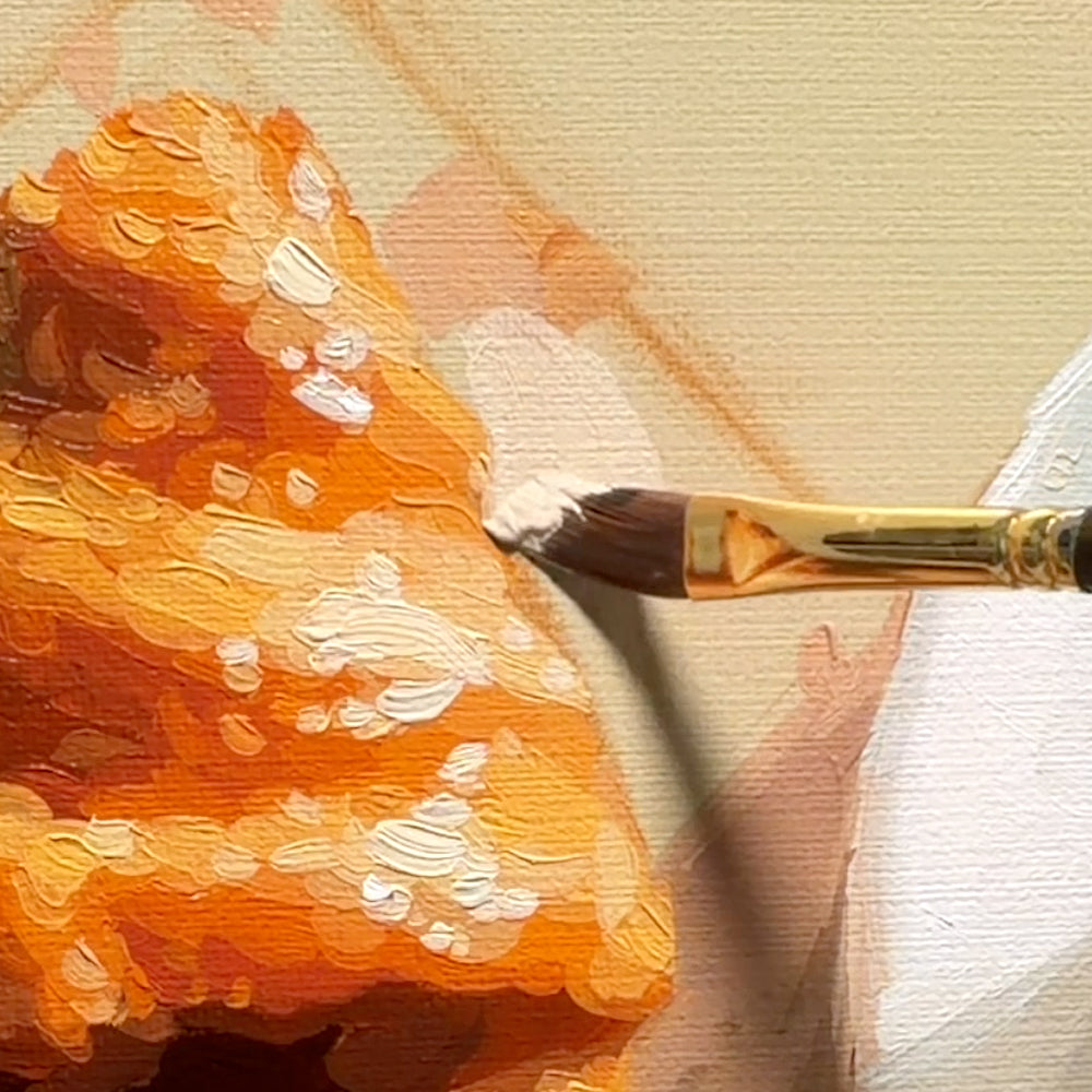 Close-up of an oil painting in progress, showing thick impasto brushstrokes of orange and white paint on a textured canvas, with a gold-handled paintbrush applying white paint.