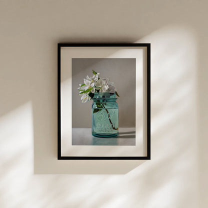 Framed fine art print of white apple blossoms in a vintage blue Ball Perfect Mason jar.