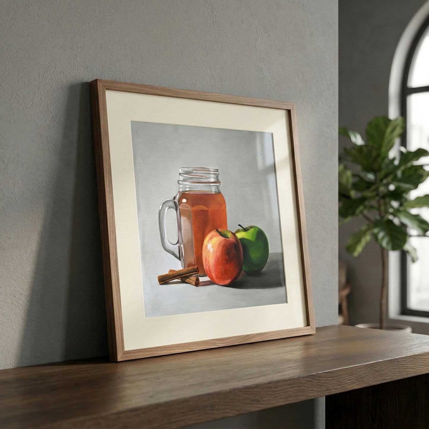 Framed fine art print of an apple cider mug, red apple, green apple, and cinnamon sticks.