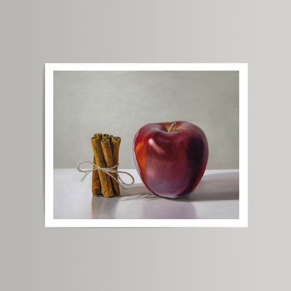 Vibrant red apple and tied cinnamon sticks on a white background, a fine art print.