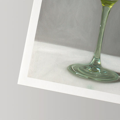 Green stemmed glass on a white surface, fine art print with a white border.