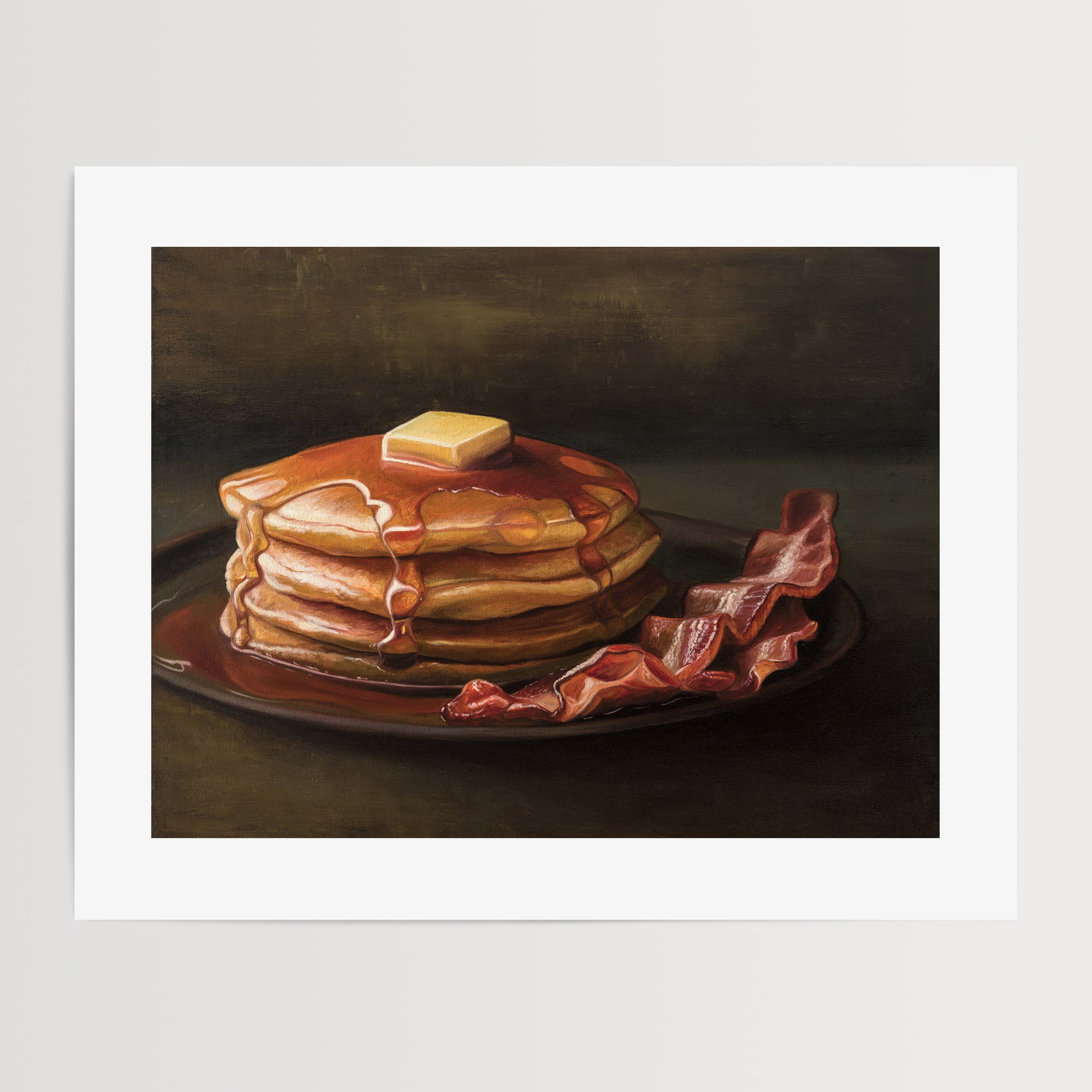 Bacon & Pancakes Fine Art Print by Lauren Pretorius: a stack of pancakes with butter and syrup resting on a plate, there are a couple of slices of bacon off to the right.