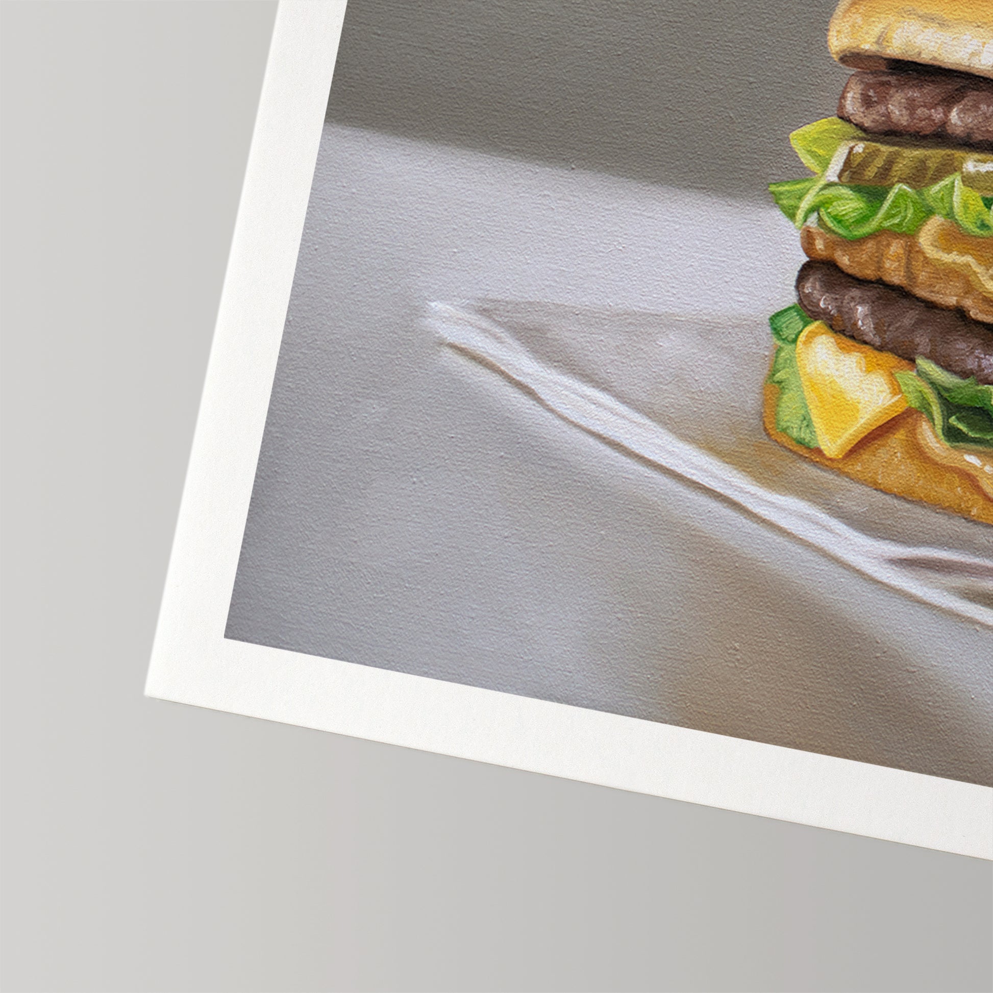 Fine art print of a Big Mac burger with two patties, cheese, lettuce, and bun, on white cotton rag paper.