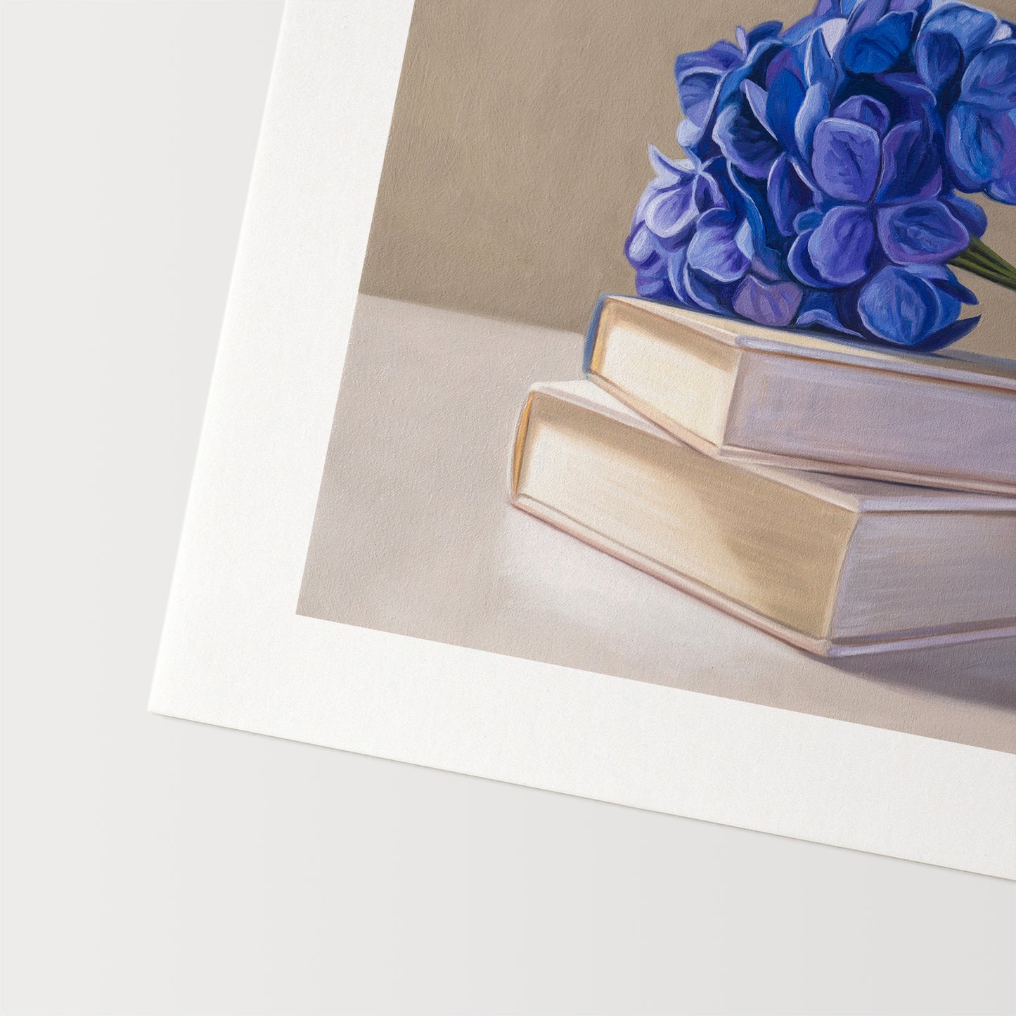Blue Hydrangeas & Books Fine Art Print by Lauren Pretorius: blue hydrangeas arranged on top of a stack of books.