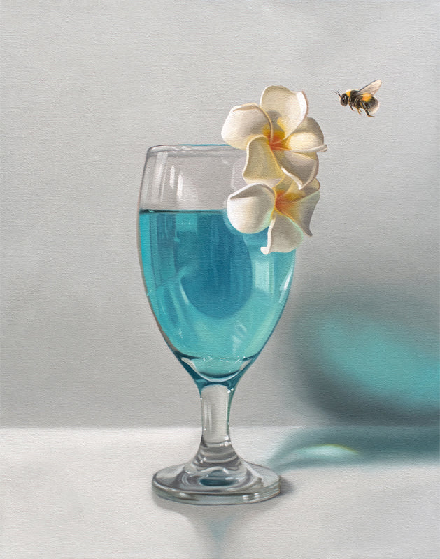 Fine art print of a glass with blue liquid, two white plumeria flowers, and a bumblebee.