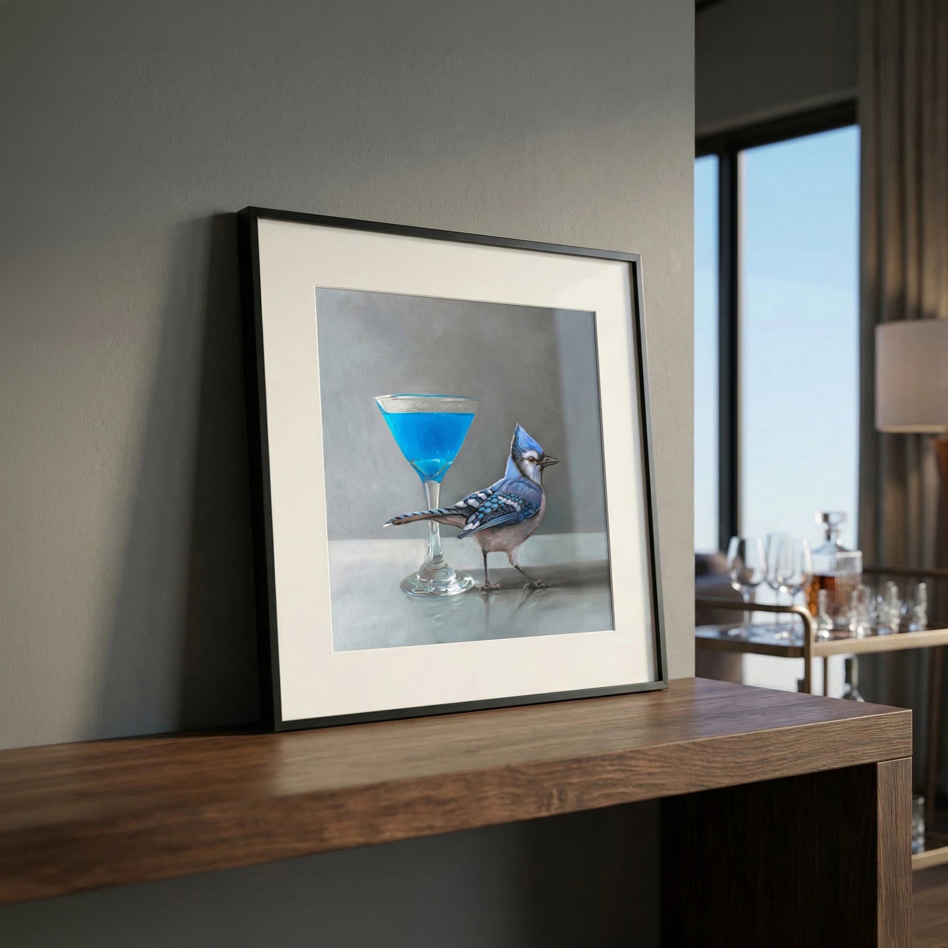 Framed fine art print of a blue jay standing next to a vibrant blue martini.