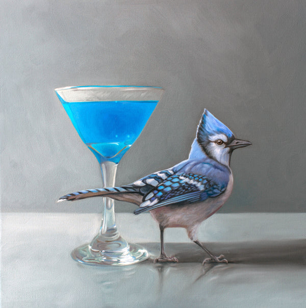Blue jay next to a blue martini on a gray background