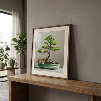 Framed fine art print featuring a leopard sleeping under a green bonsai tree in a teal pot.
