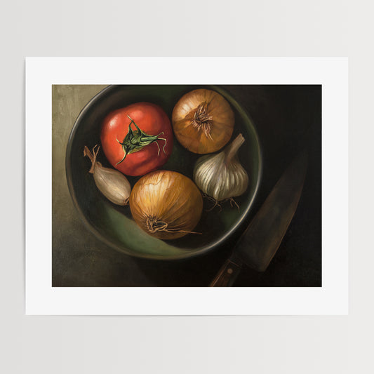 Bowl of Veggies Fine Art Print by Lauren Pretorius: a bowl of veggies from above containing a tomato, onions, garlic and a chefs knife in the shadow.