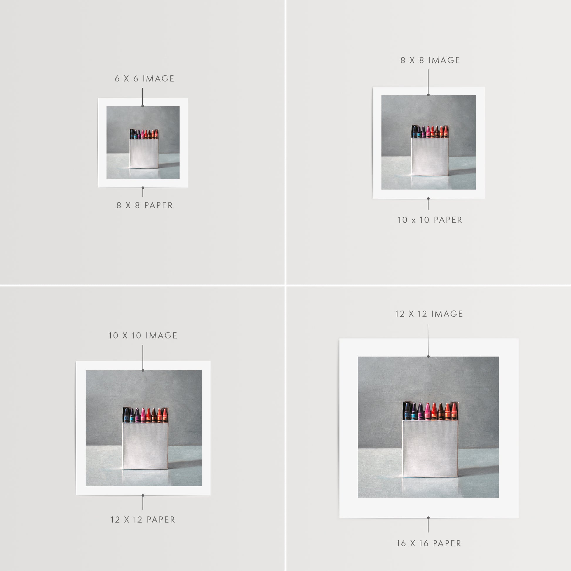 Box of Crayons Fine Art Print by Lauren Pretorius: a simple white box of crayons resting on a light reflective surface.