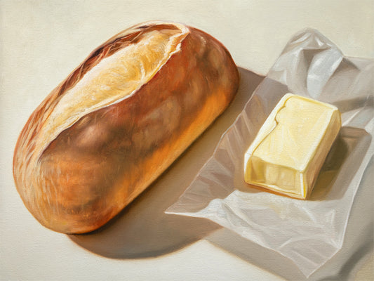 Bread & Butter Fine Art Print by Lauren Pretorius: a loaf of bread and a block of butter on a white surface.
