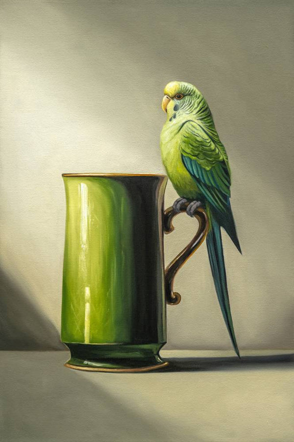 Green Budgie perched on a green mug against a neutral background