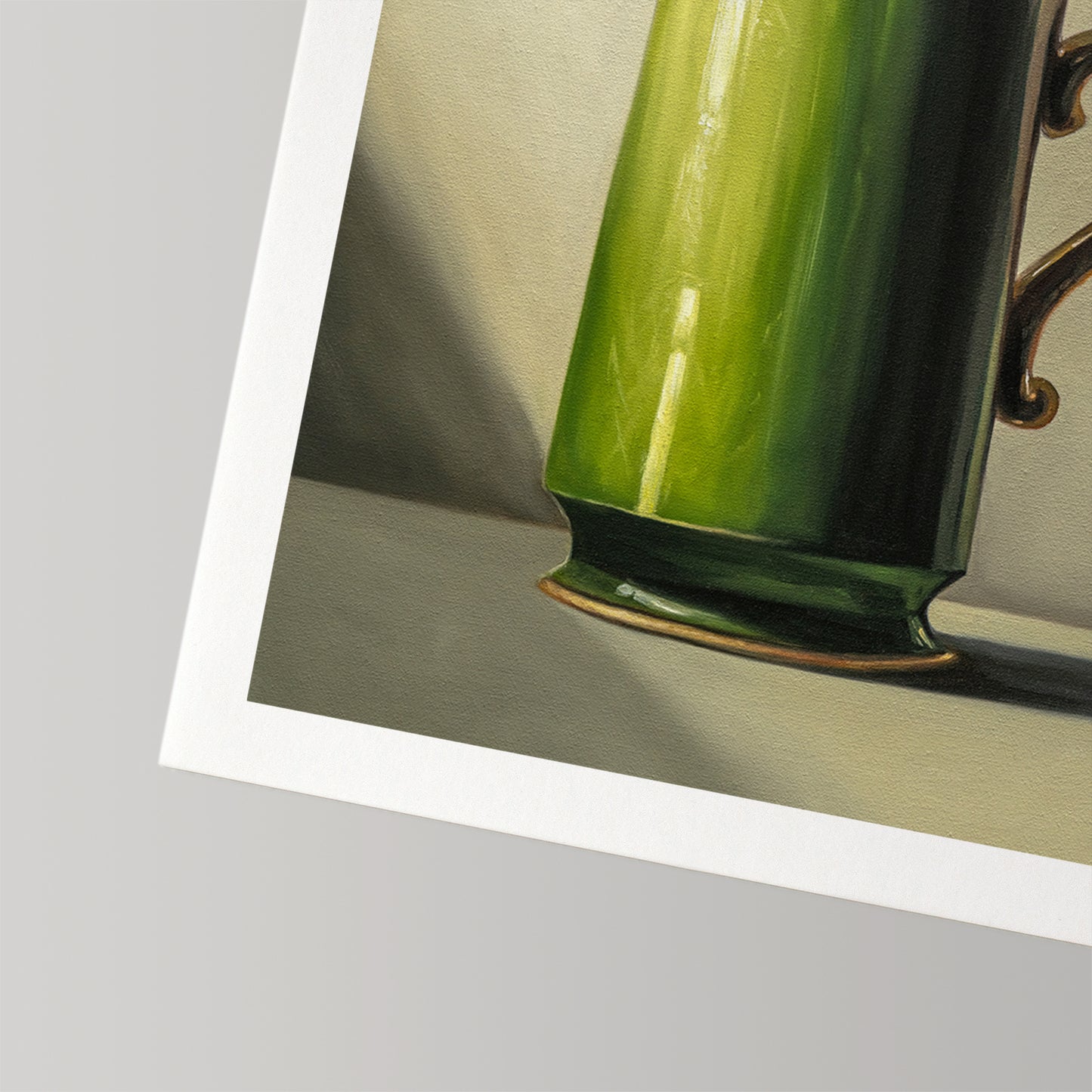 Fine art print featuring a vibrant green mug with a gold handle, on museum-grade cotton rag paper.