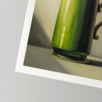 Fine art print featuring a vibrant green mug with a gold handle, on museum-grade cotton rag paper.