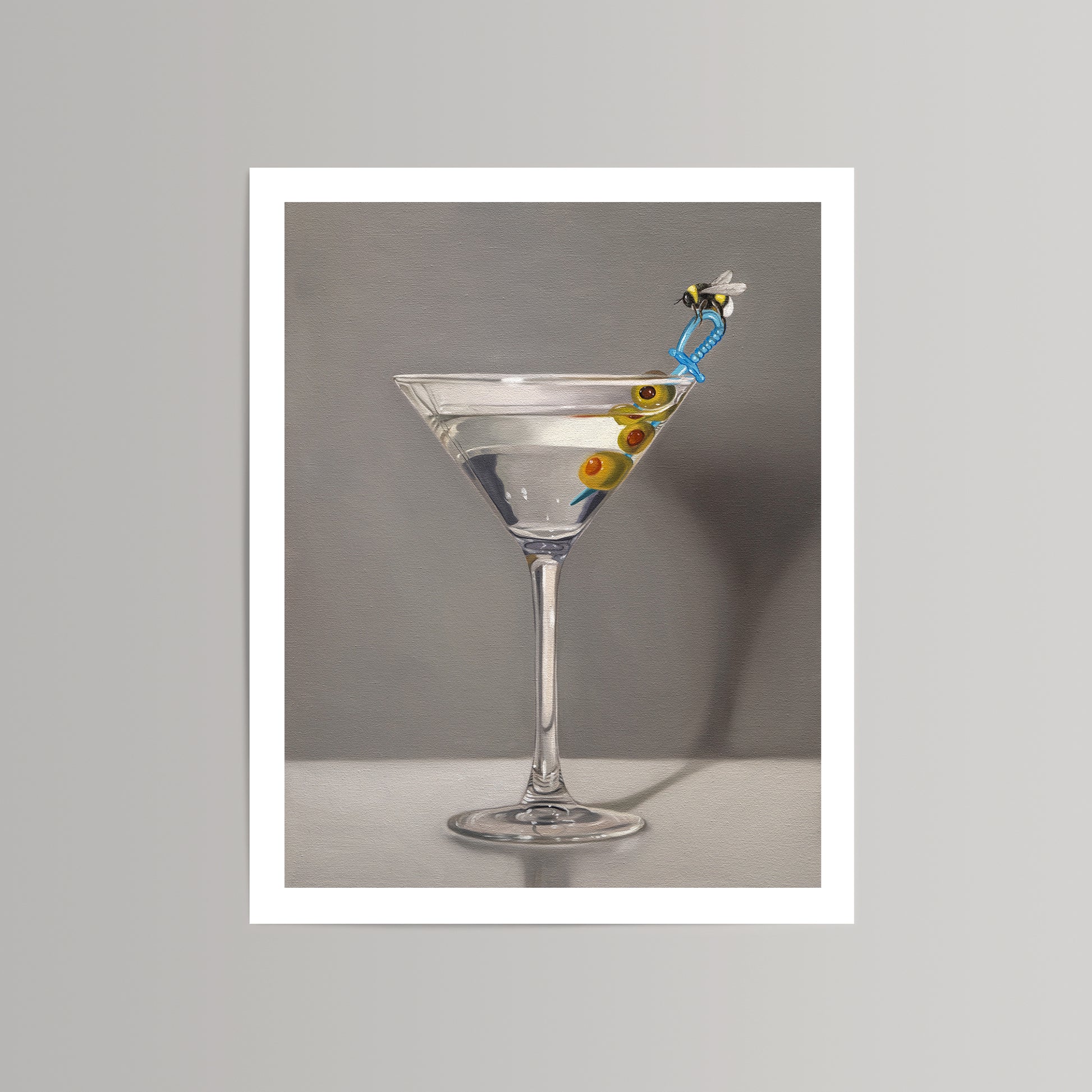 Bumble Bee Martini fine art print on cotton rag paper, featuring a martini glass with olives and a bee on a blue straw.