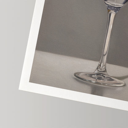 Close-up of a fine art print featuring a clear martini glass stem and base on a gray background with a white border.