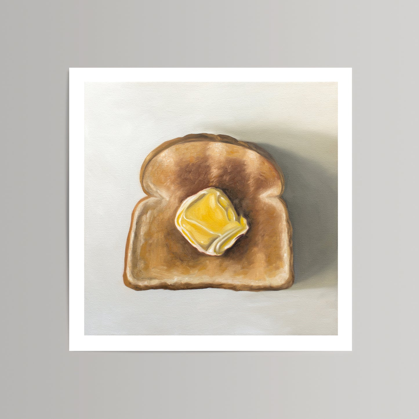 Buttered Toast fine art print on cotton rag paper, featuring a golden brown toast slice with melting yellow butter.