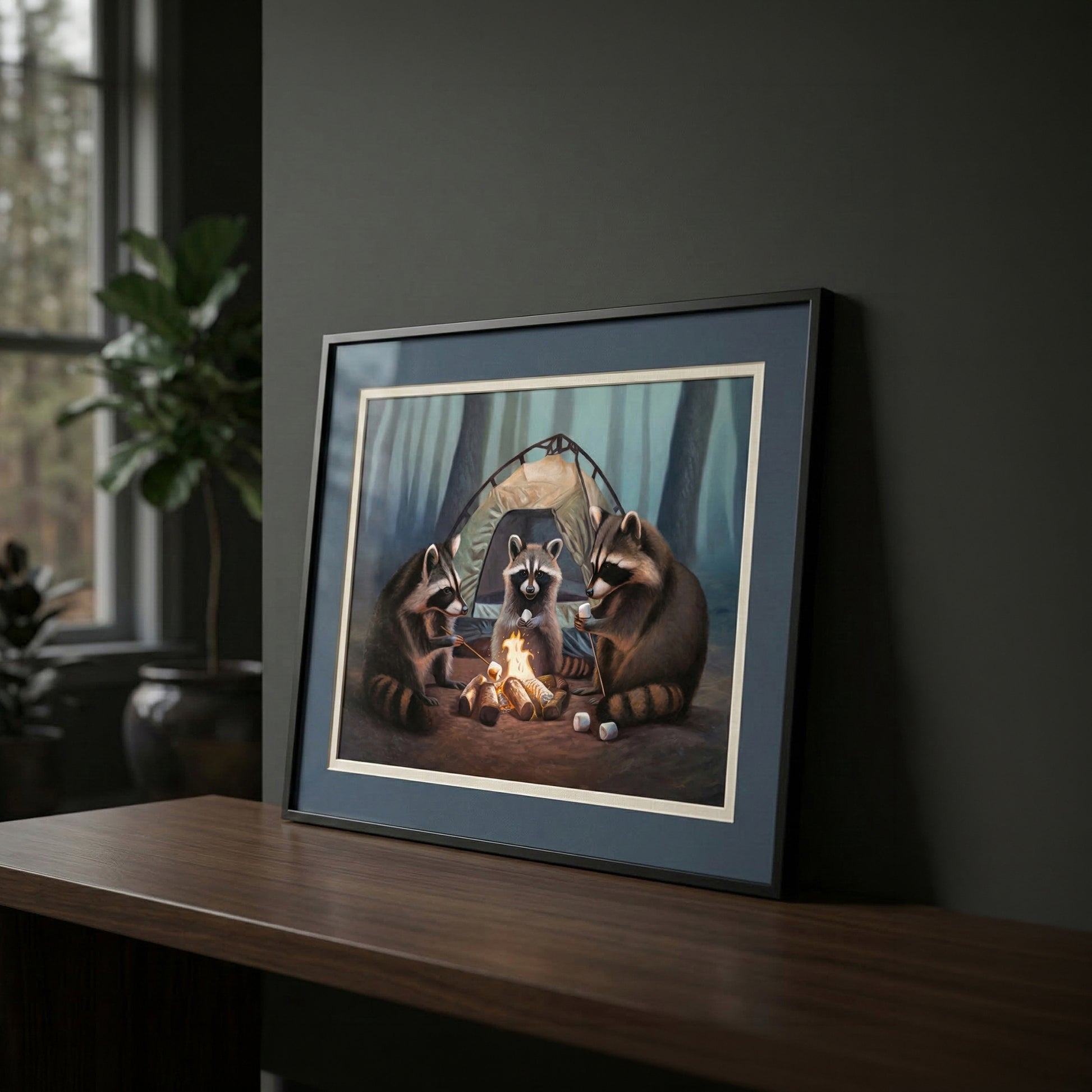 Framed fine art print of three raccoons roasting marshmallows around a campfire outside a tent in a forest.
