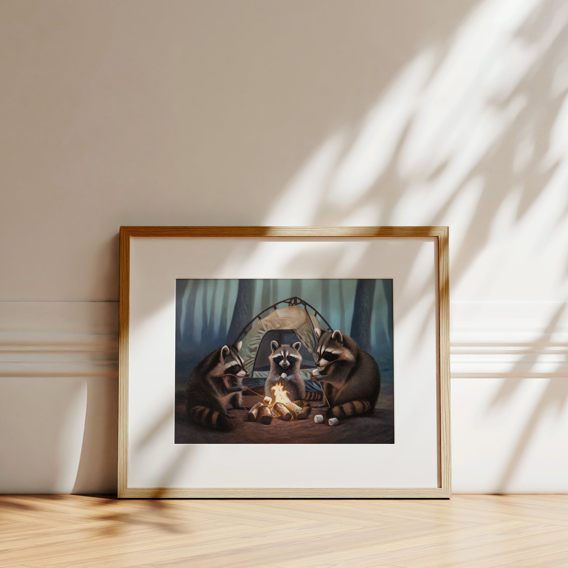 Framed fine art print of three raccoons camping, roasting marshmallows over a campfire in a forest.
