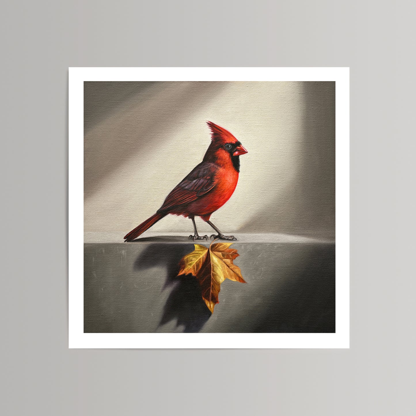 Fine art print of a vibrant red cardinal standing next to a golden maple leaf on a textured background.