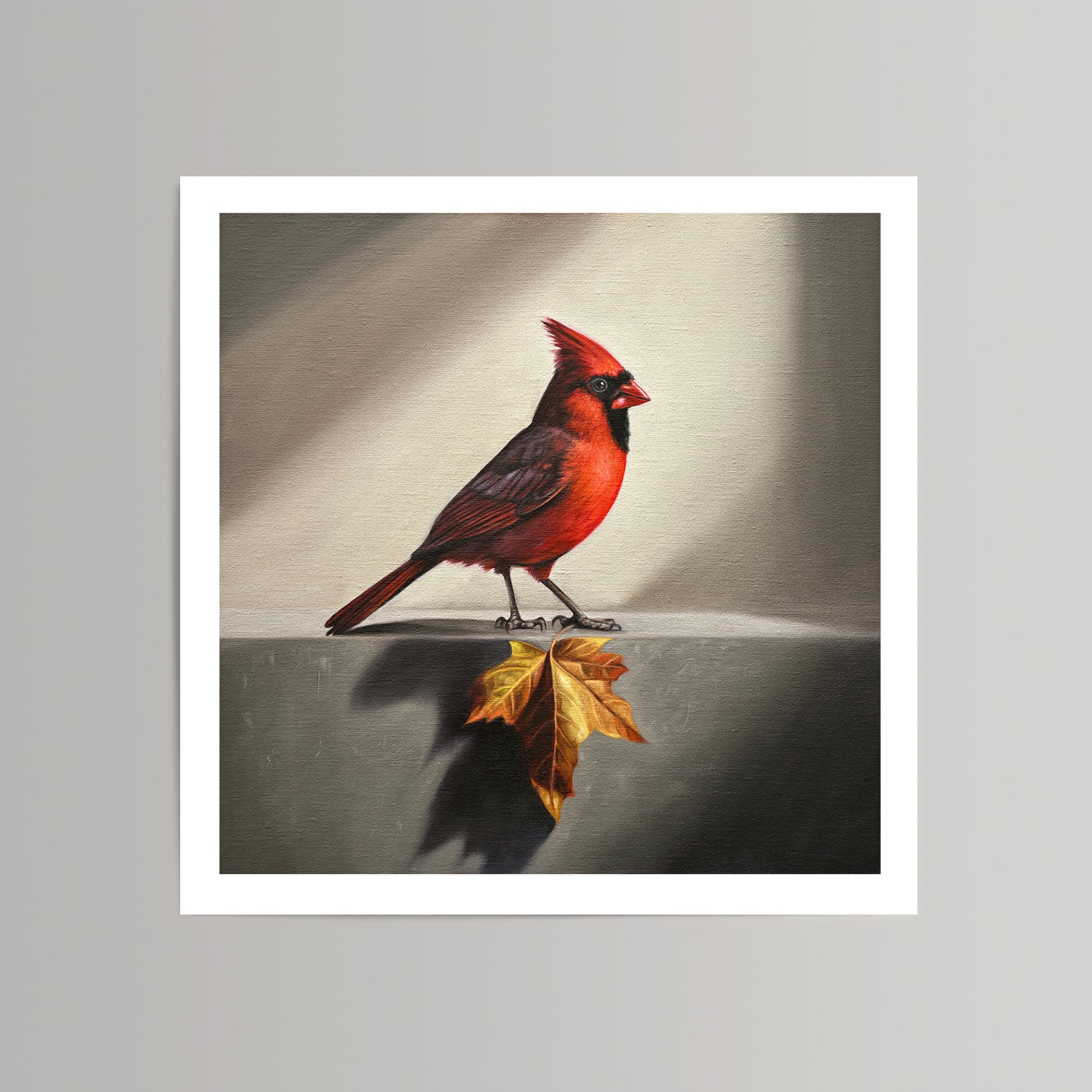 Fine art print of a vibrant red cardinal standing next to a golden maple leaf on a textured background.