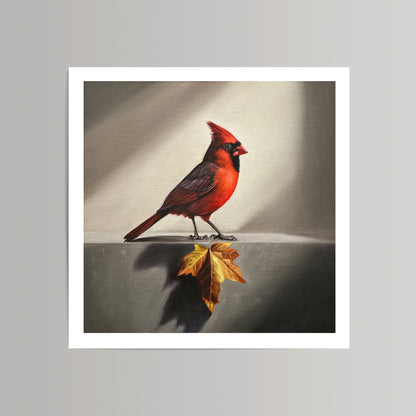 Fine art print of a vibrant red cardinal standing next to a golden maple leaf on a textured background.