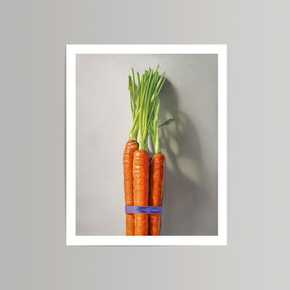 Fine art print of a vibrant orange carrot bunch with green tops, tied with a purple band, on a light gray background.