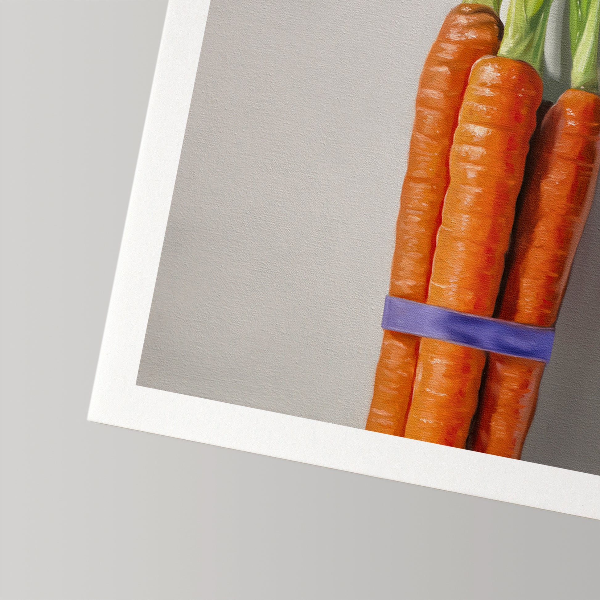 Fine art print of a vibrant orange carrot bunch tied with a purple band, on museum-grade cotton rag paper.