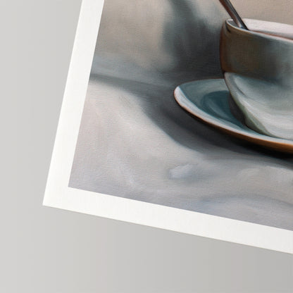 Fine art print of a light blue teacup and saucer with a spoon, on museum-grade cotton rag paper.
