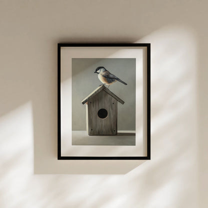 Framed fine art print of a chickadee perched on a rustic wooden birdhouse, featuring soft, natural colors.