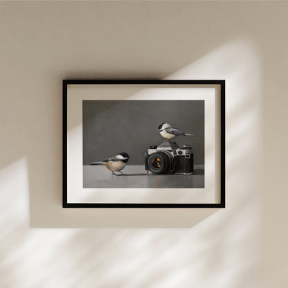 Chickadees & Camera Fine Art Print by Lauren Pretorius: a pair of inquisitive Chickadees investigating a vintage 35mm Canon Camera.