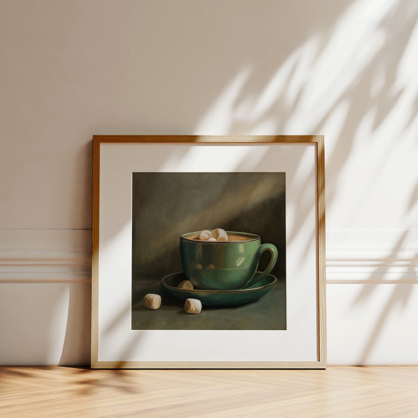 Cocoa & Marshmallows Fine Art Print by Lauren Pretorius: a green mug with marshmallows spilling out, placed on a surface with a shadow falling over part of the image.
