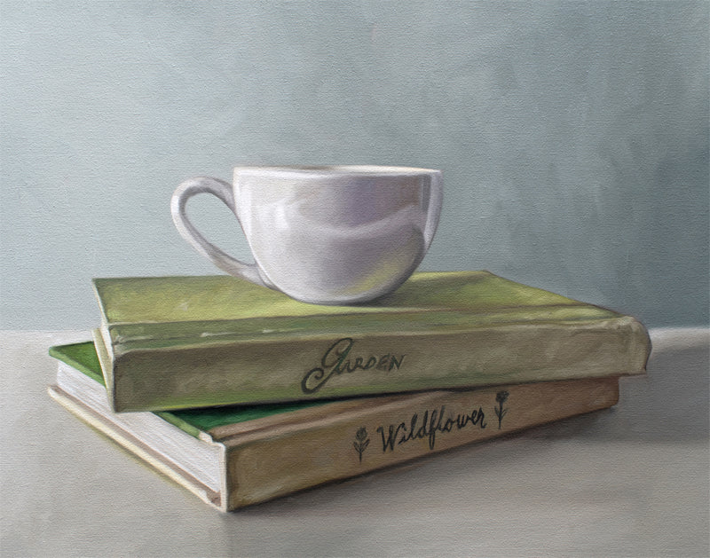 Still life painting of a white coffee cup resting on two stacked vintage-style books, "Garden" and "Wildflower.