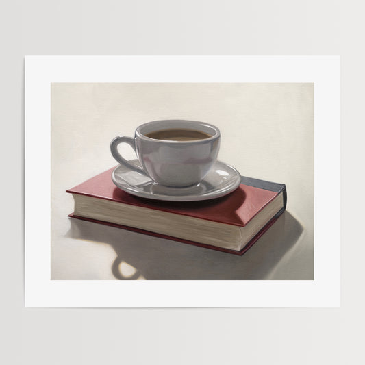 Coffee & Book Fine Art Print by Lauren Pretorius: a backlit coffee cup and saucer resting on top of a red book.