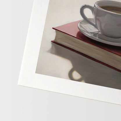 Coffee & Book Fine Art Print by Lauren Pretorius: a backlit coffee cup and saucer resting on top of a red book.