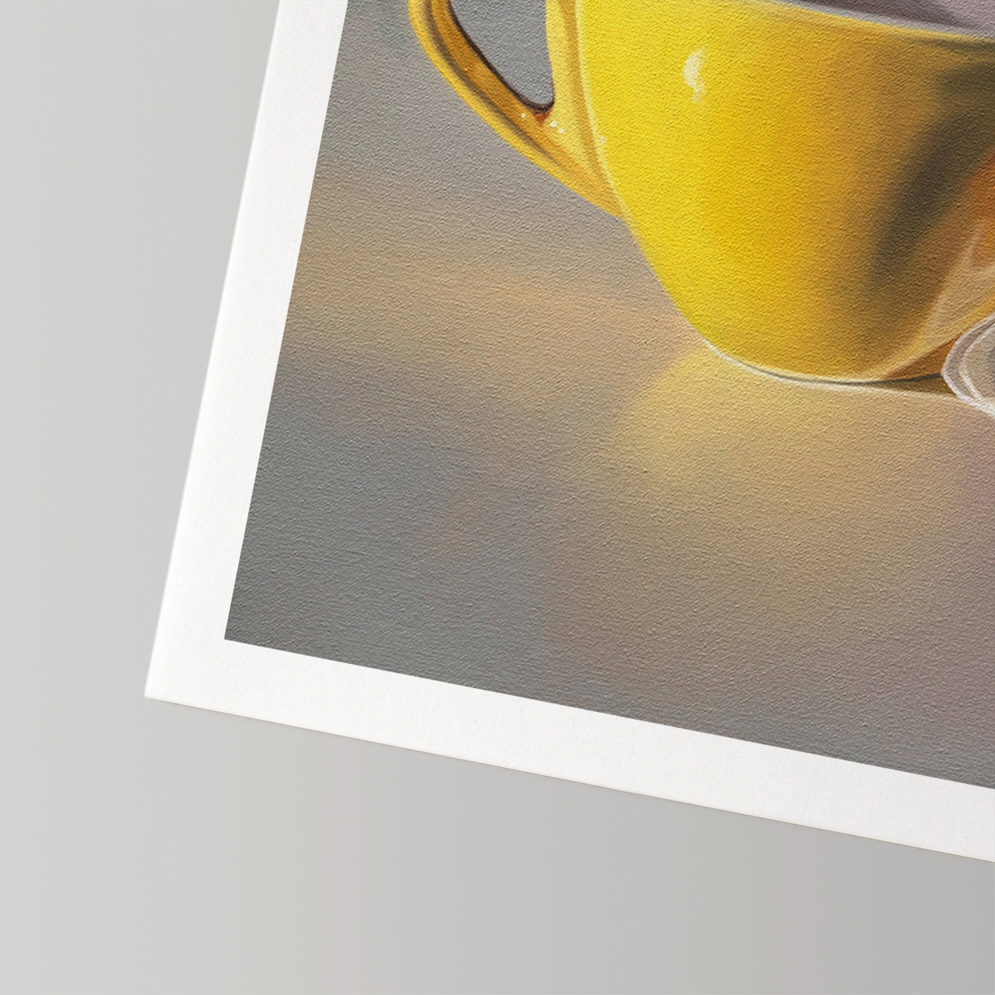 Vibrant fine art print of a yellow coffee cup on museum-grade cotton rag paper with a white border.