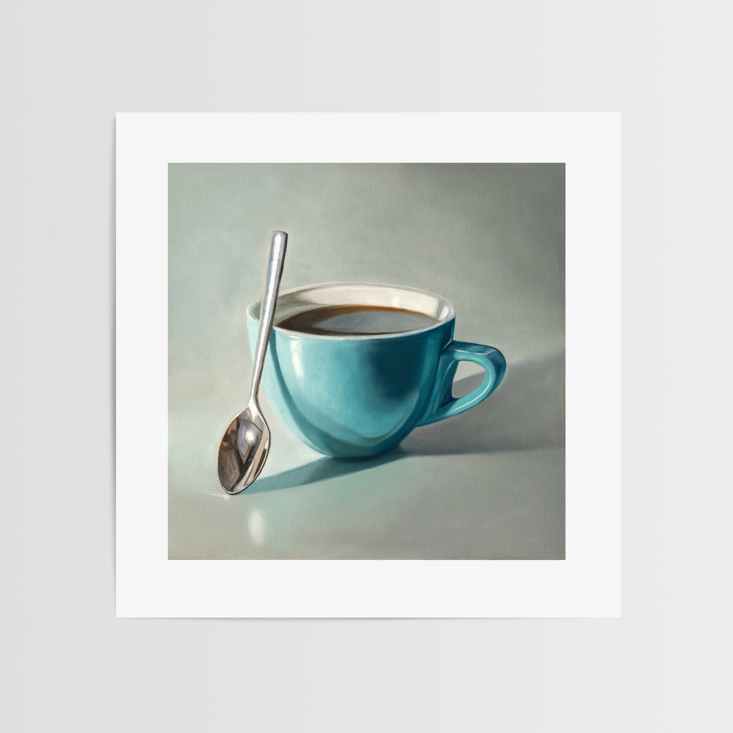 Coffee Cup & Spoon Fine Art Print by Lauren Pretorius: a blue cup of coffee with a spoon resting on the cup.