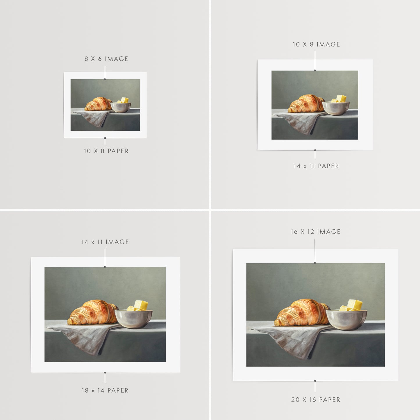 Croissant & Butter Fine Art Print by Lauren Pretorius: a croissant and a block of butter on a white surface with a grey background.