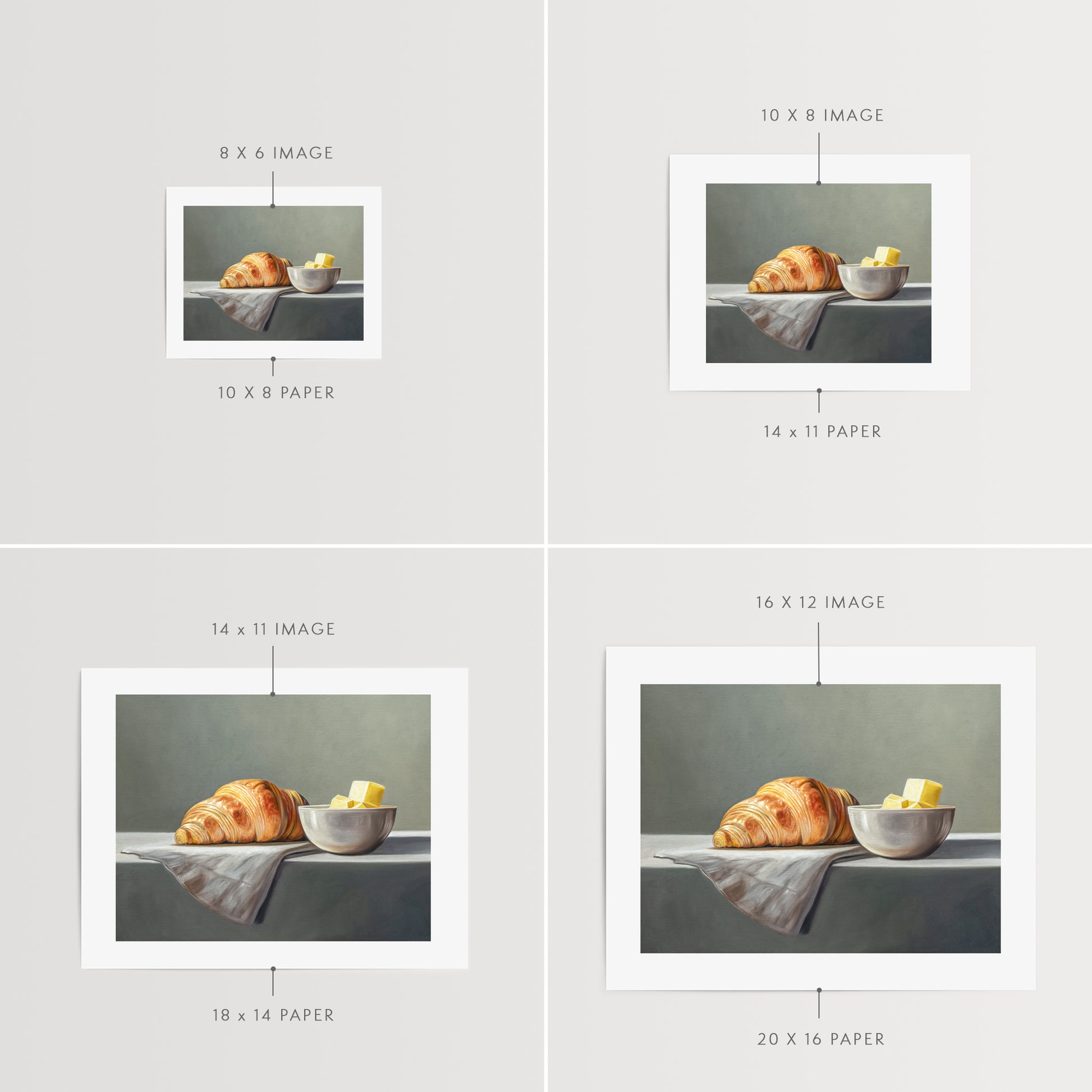 Croissant & Butter Fine Art Print by Lauren Pretorius: a croissant and a block of butter on a white surface with a grey background.