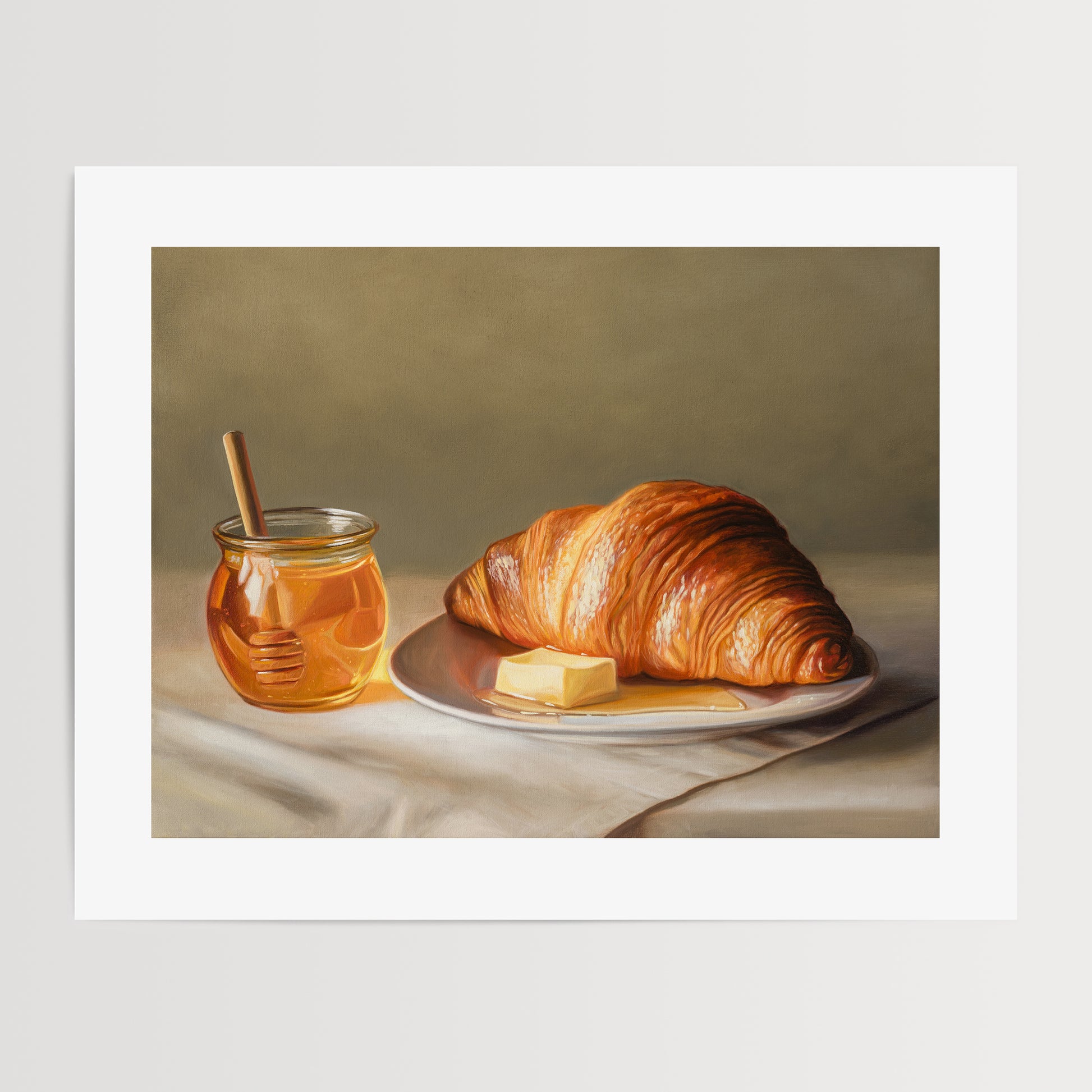 Croissant, Honey & Butter Fine Art Print by Lauren Pretorius: a croissant with honey and butter on a plate.
