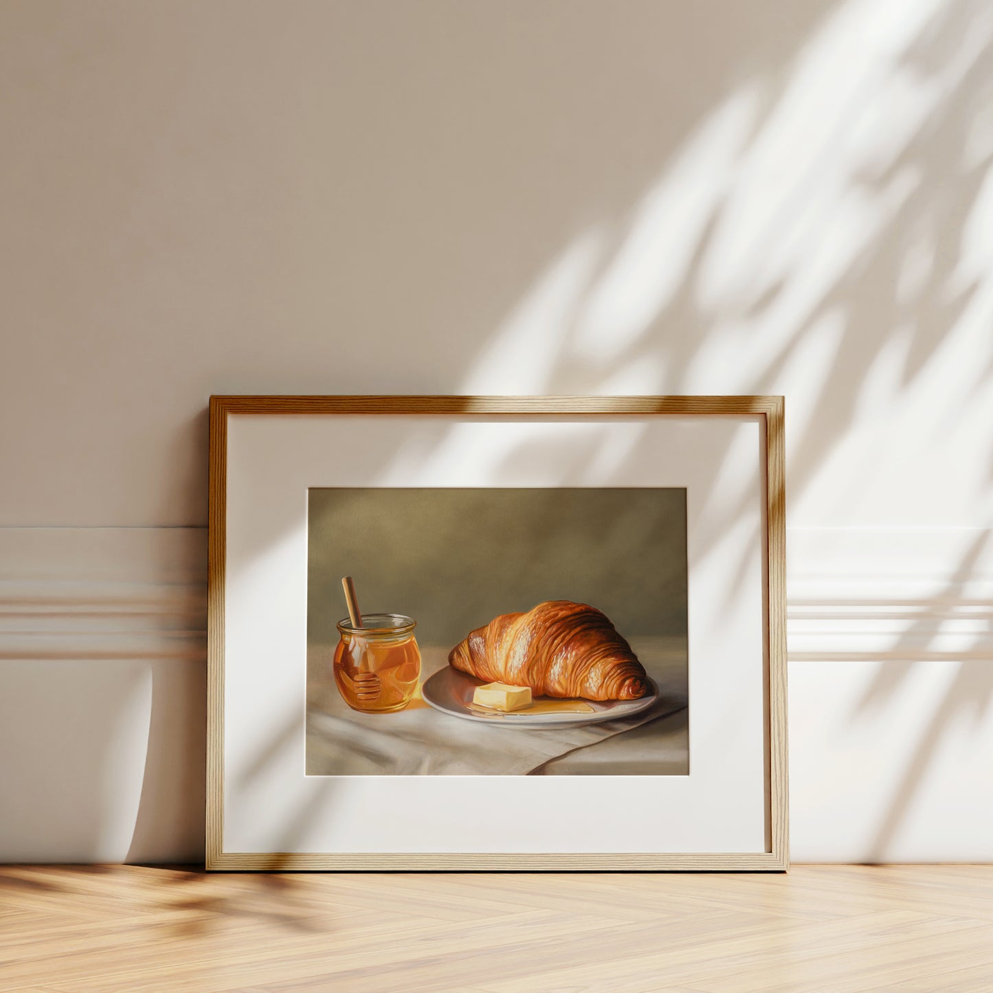 Croissant, Honey & Butter Fine Art Print by Lauren Pretorius: a croissant with honey and butter on a plate.