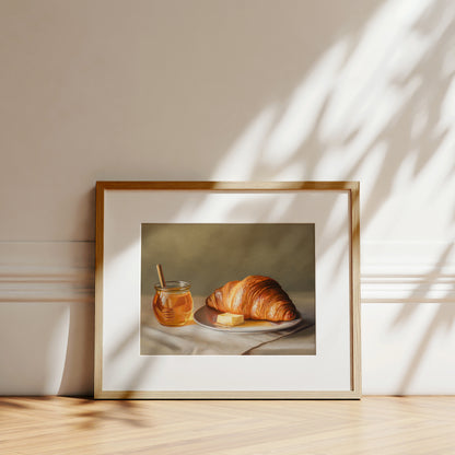 Croissant, Honey & Butter Fine Art Print by Lauren Pretorius: a croissant with honey and butter on a plate.
