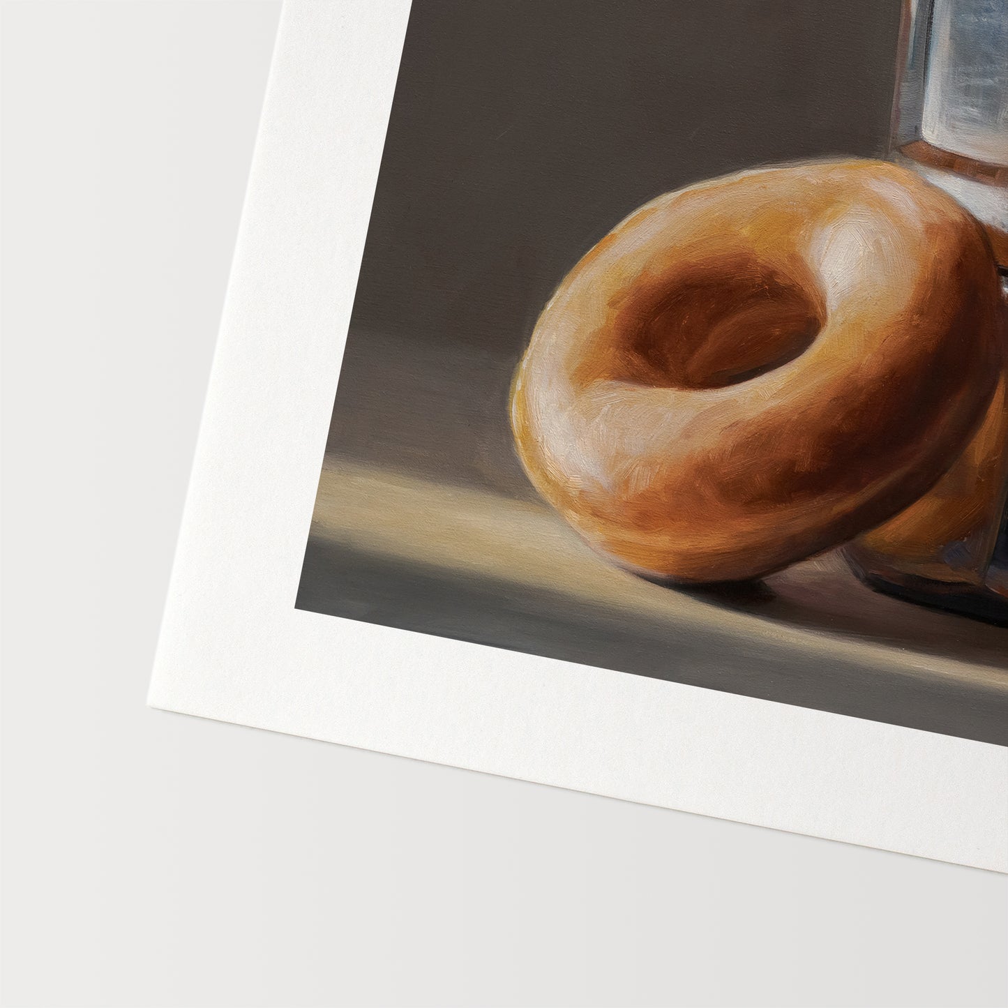 Donut & Moka Pot Fine Art Print by Lauren Pretorius: A reflective moka post espresso maker next to a donut.
