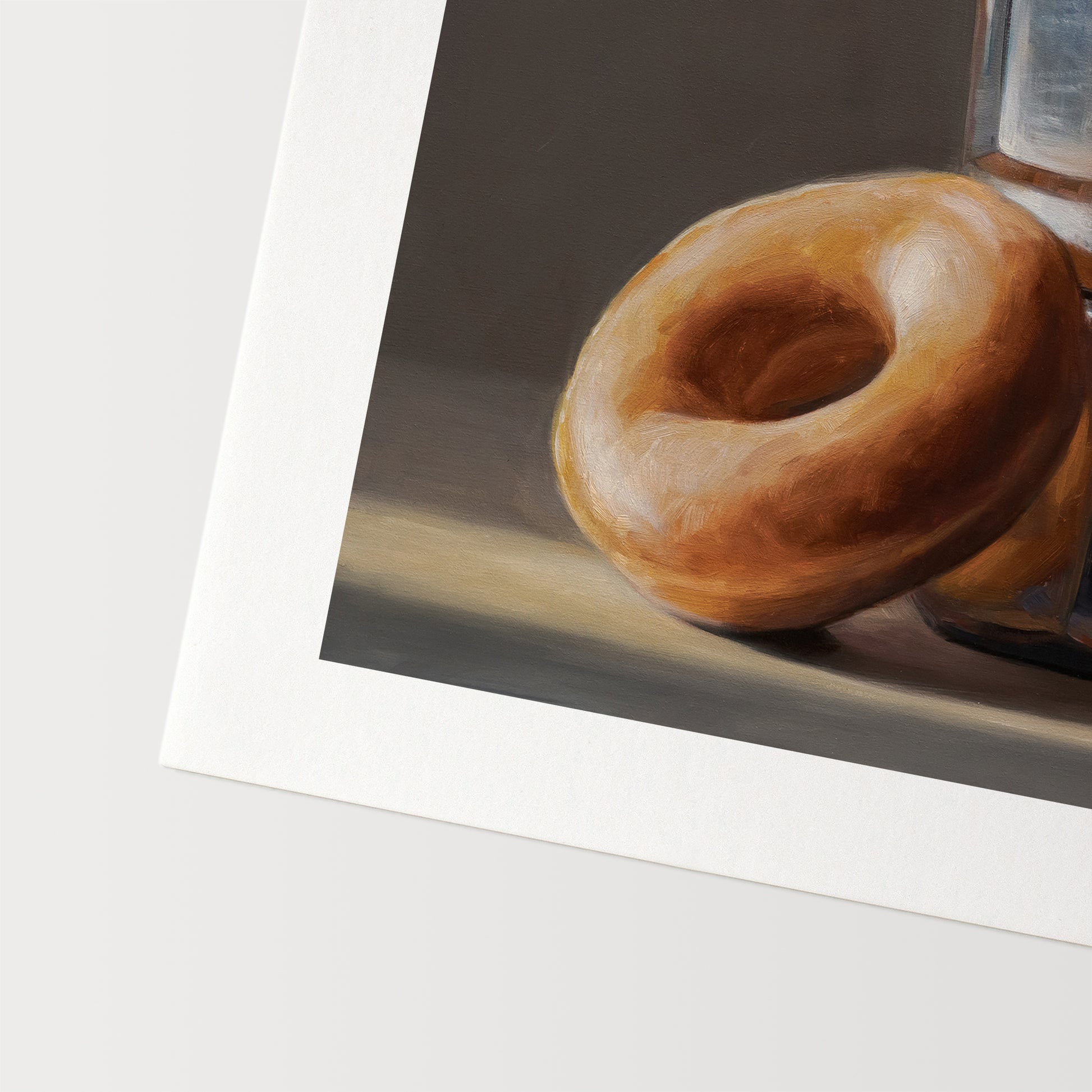 Donut & Moka Pot Fine Art Print by Lauren Pretorius: A reflective moka post espresso maker next to a donut.