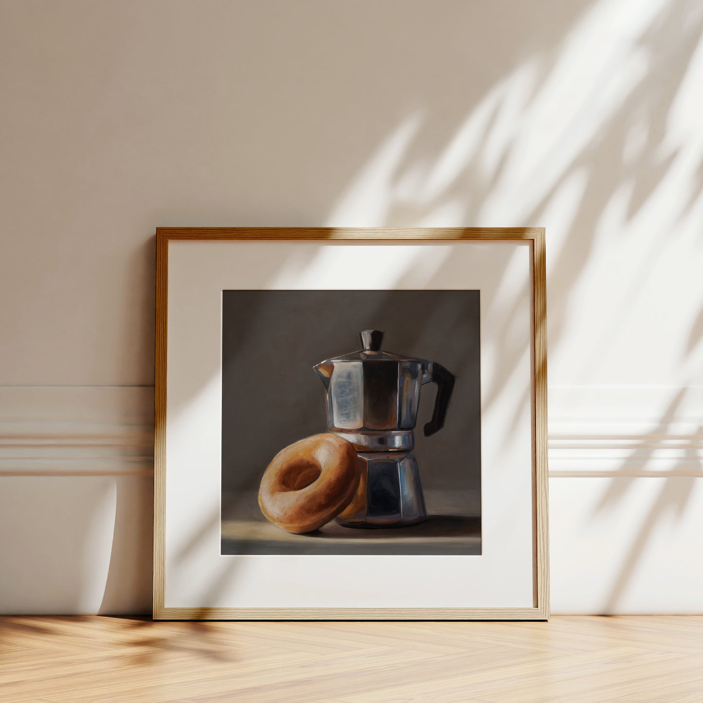 Donut & Moka Pot Fine Art Print by Lauren Pretorius: A reflective moka post espresso maker next to a donut.