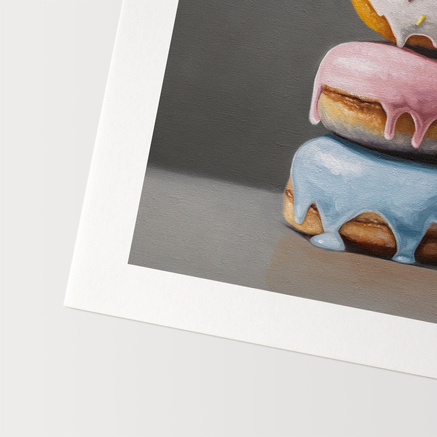 Donut Stack Trio Fine Art Print by Lauren Pretorius: a trio of donuts with different colored frosting stacked top of each other.