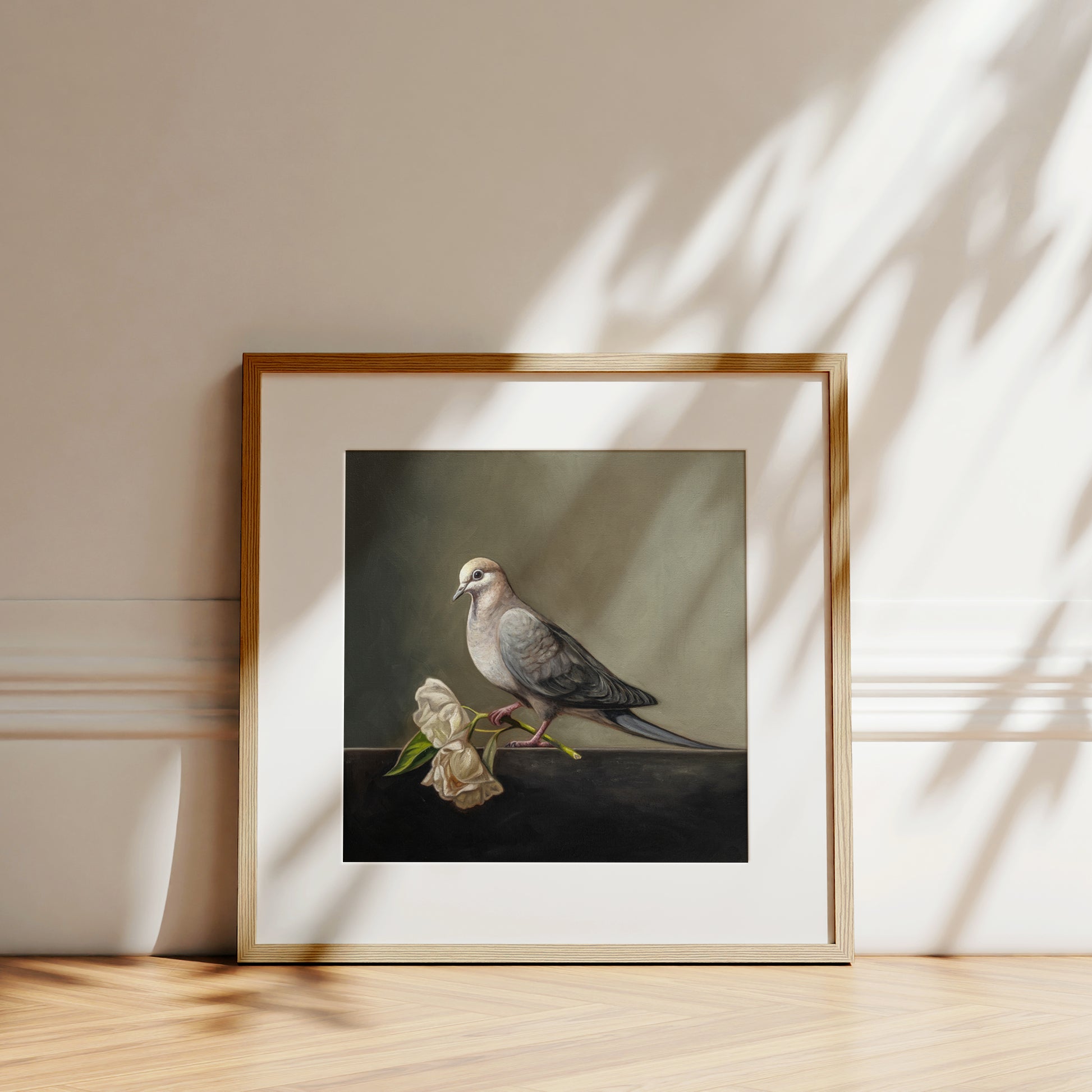 Dove & Roses Fine Art Print by Lauren Pretorius: a Mourning Dove holding a pair of wilting white roses.