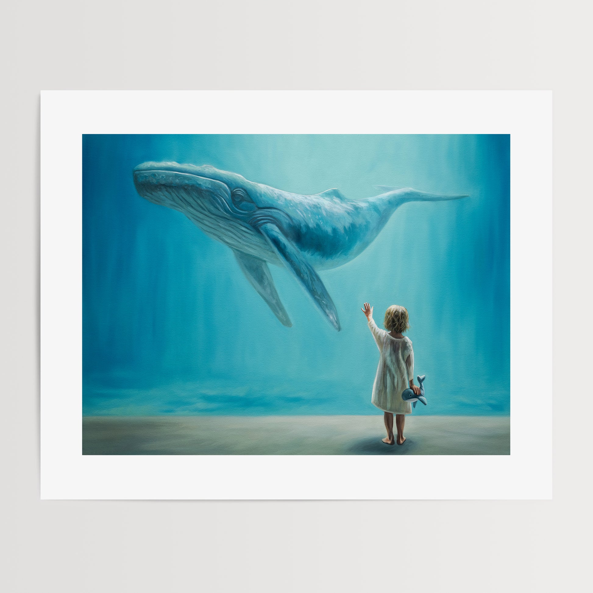 Dreaming of Giants, Whale and Child Fine Art Print by Lauren Pretorius: a dreamlike vision of a young child holding a plush whale reaching upwards to a whale swimming above.
