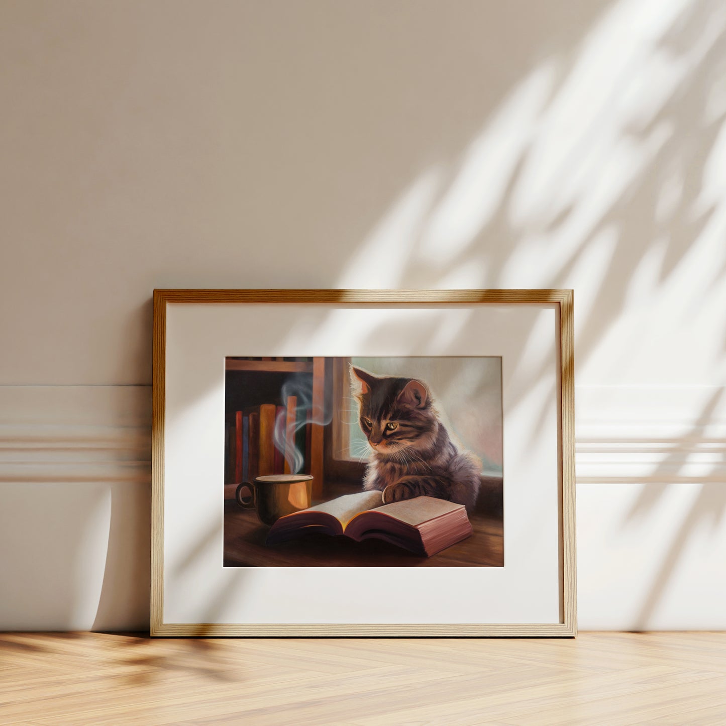 Feline Fiction Fine Art Print by Lauren Pretorius: a cat seemingly reading a book by a window and book case with a steaming cup of coffee.