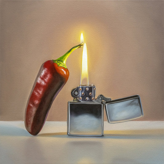 Fiery Jalapeño Fine Art Print by Lauren Pretorius: a red hot Jalapeño with its stem catching fire from a reflective Zippo lighter.